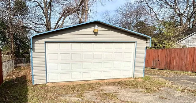 a small white house with a outdoor space