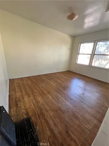 a bathroom with a sink toilet and window