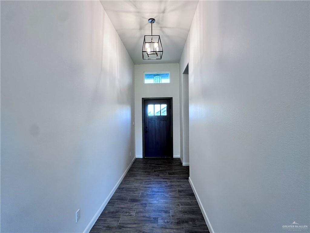 1100 Azalea Street Mission, TX 78573 - Photo 6 of 24 a view of a hallway with wooden floor