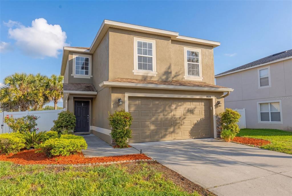 253 Bella Rosa Circle Sanford, FL 32771 - Photo 1 of 22 a front view of a house with a yard
