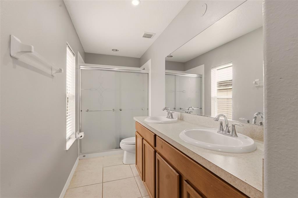 253 Bella Rosa Circle Sanford, FL 32771 - Photo 14 of 22 a bathroom with a sink and a mirror