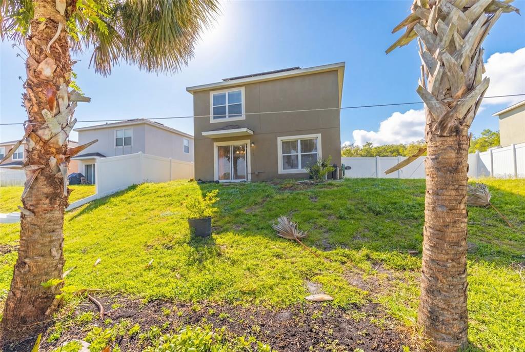 253 Bella Rosa Circle Sanford, FL 32771 - Photo 22 of 22 a house with swimming pool in front of it