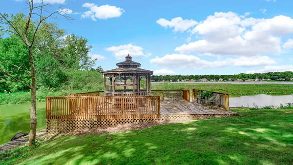a view of a lake with a garden
