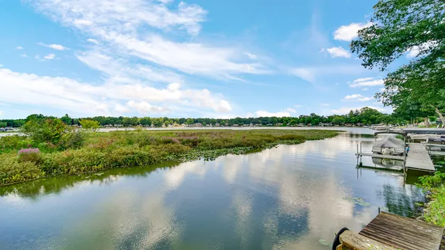 a view of a lake with houses in the back