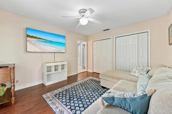 a living room with furniture and a rug