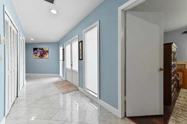 a view of a hallway with hallway and closet