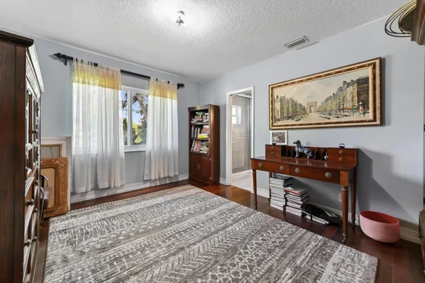 a bed room with a bed and a television