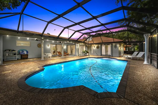 a view of a swimming pool with a patio