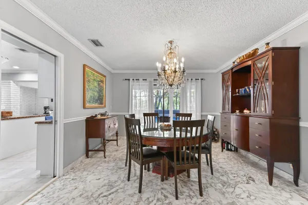 a view of a dining room with furniture