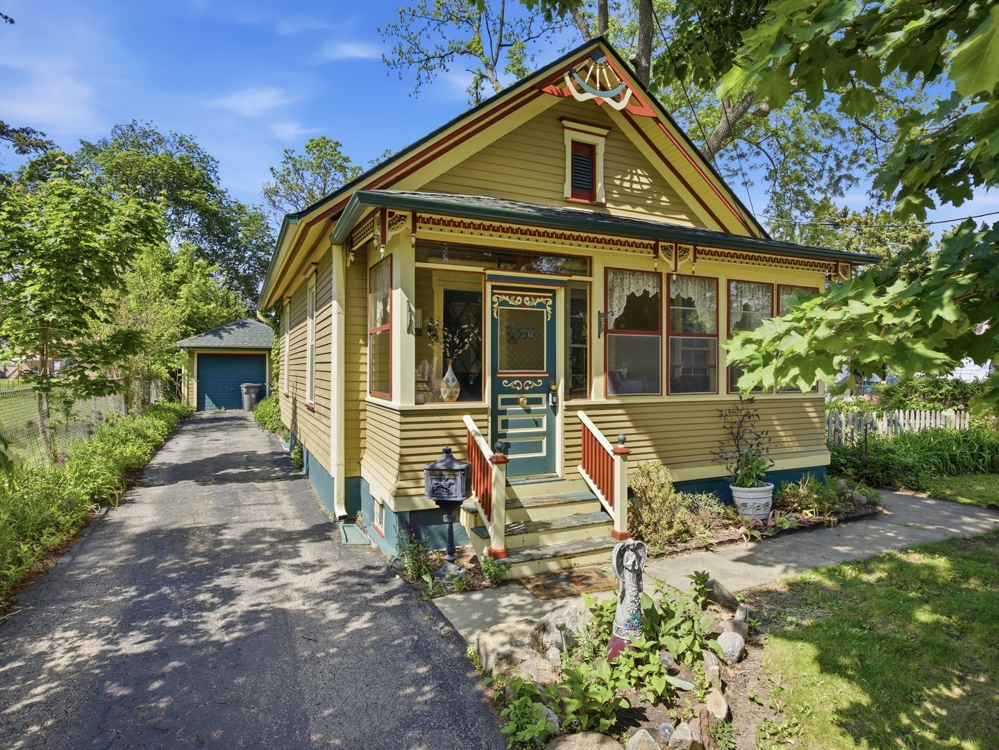 570 Addison Street Elgin, IL 60120 - Photo 2 of 17 a front view of a house with garden