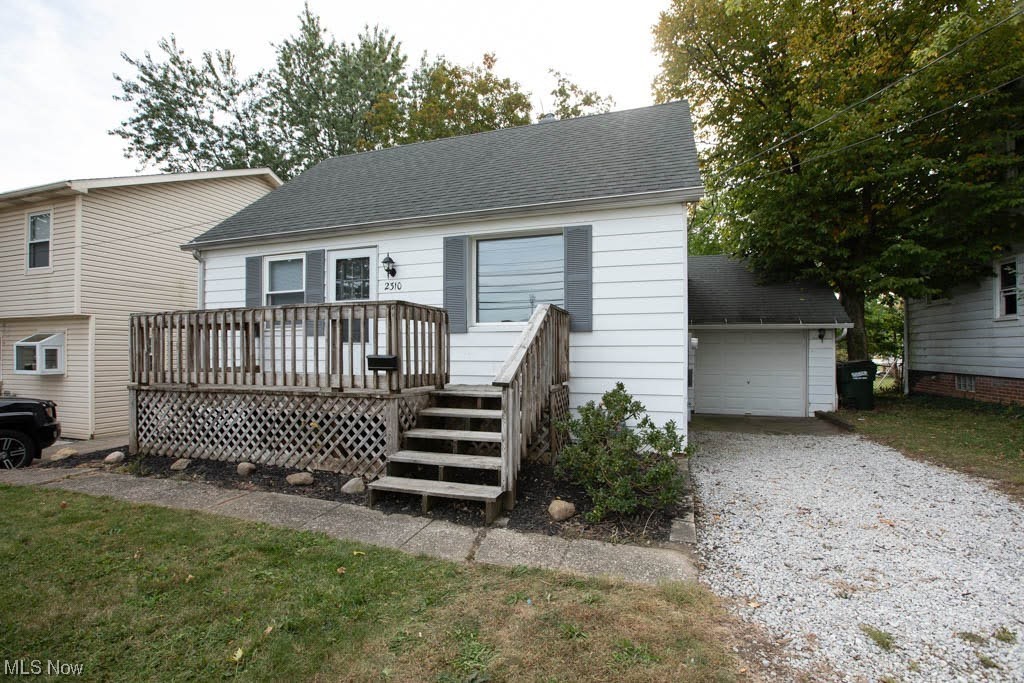 2310 Rockefeller Road Wickliffe, OH 44092 - Photo 25 of 35 View of front of property featuring a wooden deck and a garage
