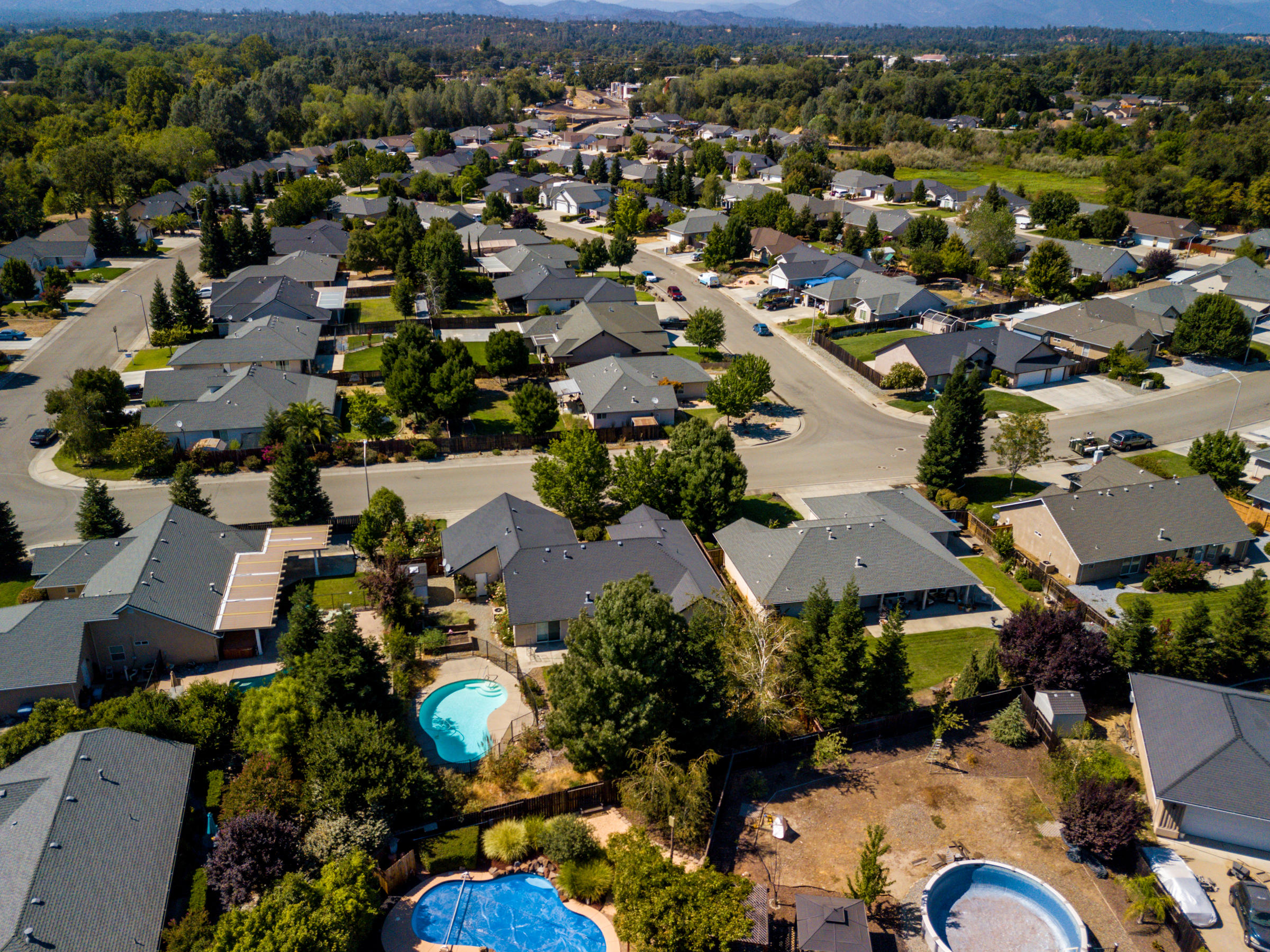7776 Pit Road Redding, CA 96001 - Photo 13 of 24 an aerial view of multiple houses with yard