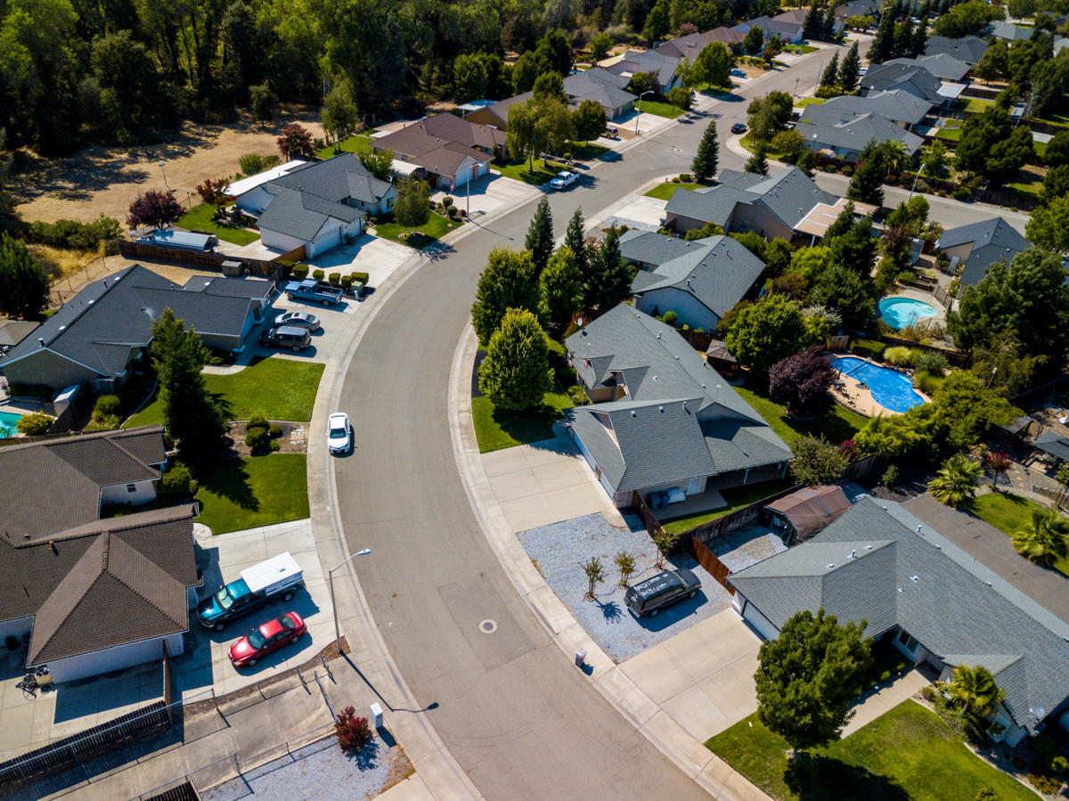 7776 Pit Road Redding, CA 96001 - Photo 14 of 24 an aerial view of residential houses with outdoor space