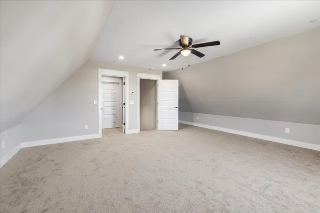 an empty room with a empty space and windows