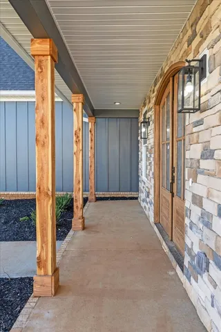 a view of an entryway with wooden floor