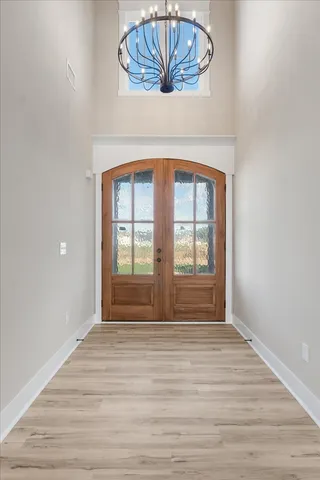 a view of entryway with wooden floor