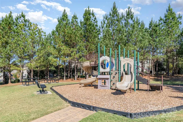 a view of a park with swings and slides
