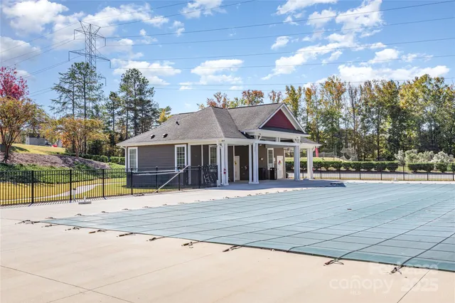 a view of a house with basketball court