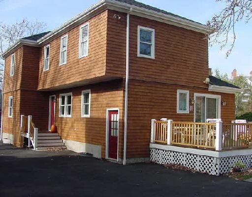 a front view of a house with a fence