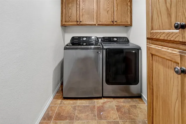 a utility room with washer and dryer