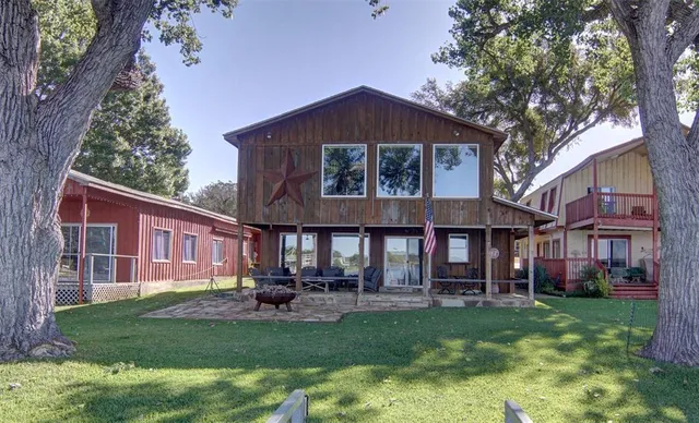 a view of a house with a yard porch and sitting area