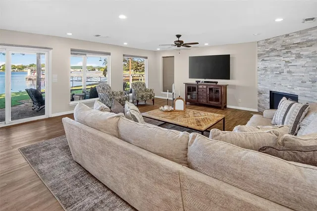 a living room with fireplace furniture and a flat screen tv