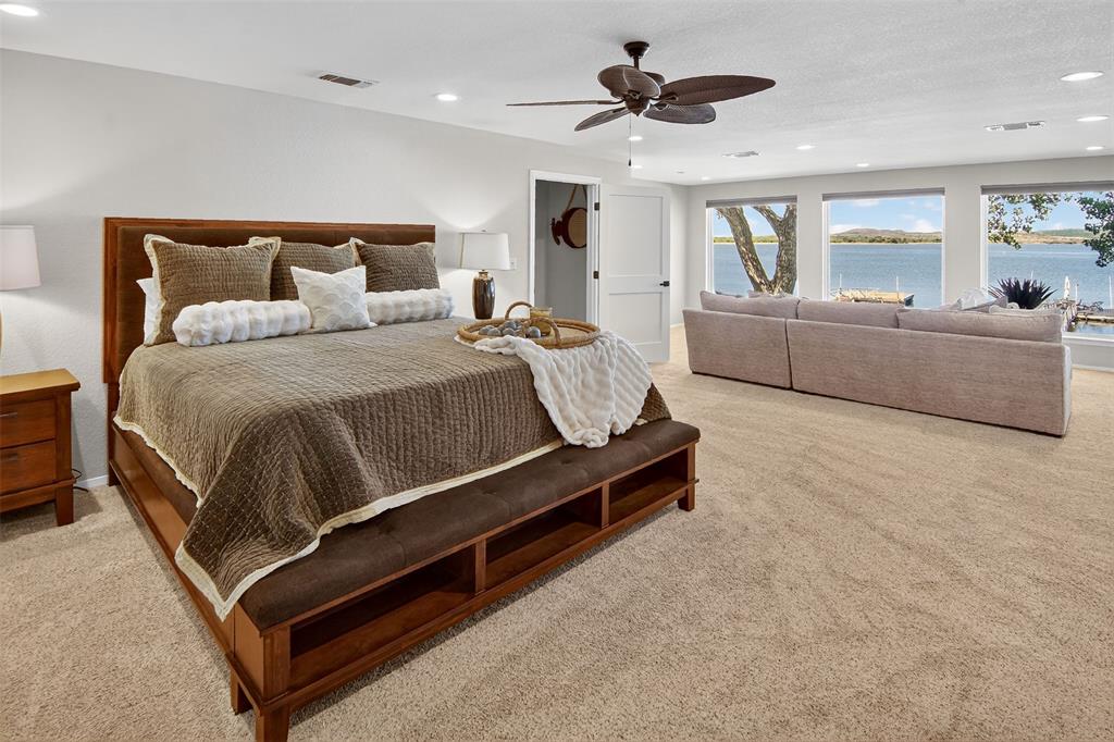 1601 Forum Circle, Unit 147 Graford, TX 76449 - Photo 30 of 38 Entire upstairs is one, huge primary suite complete with a very generous walk in closet and how about that view!?