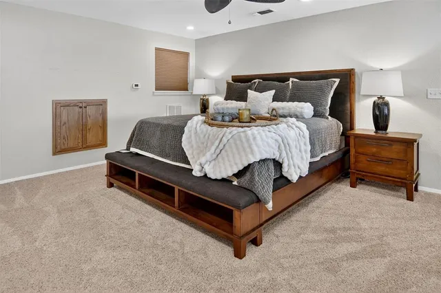 a living room with furniture potted plant and a table
