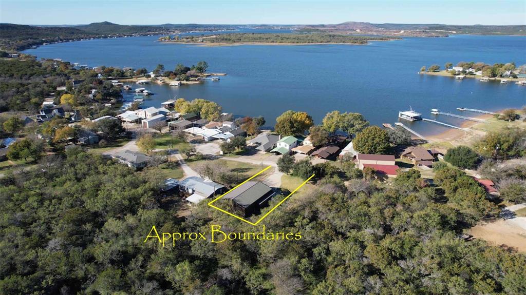 1601 Forum Circle, Unit 147 Graford, TX 76449 - Photo 5 of 38 Second lot is huge with amazing landscaped yard and boat barn.