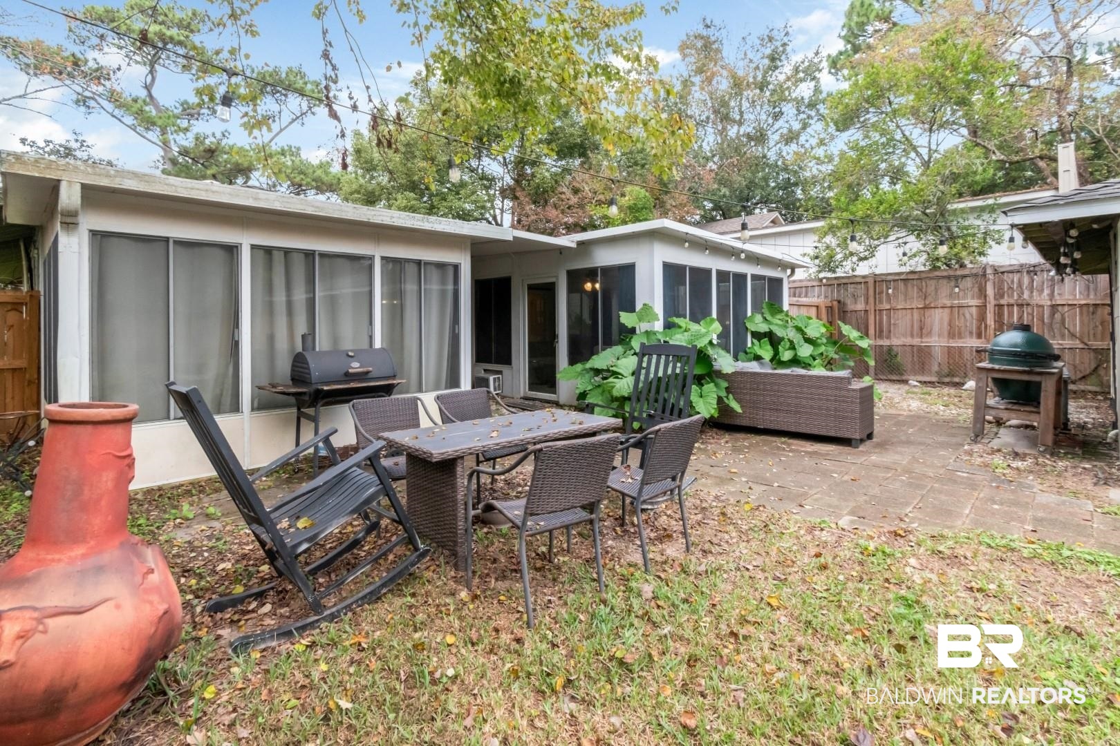 20 Kirby Street Mobile, AL 36607 - Photo 21 of 35 Exterior space featuring a sunroom, an outdoor living space, and a patio area
