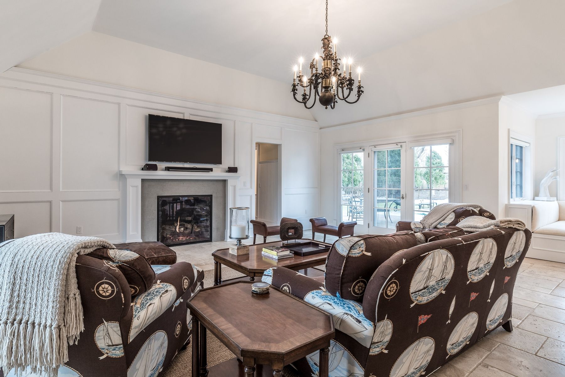 8 Pondview Lane East Hampton, NY 11937 - Photo 15 of 23 a living room with furniture a fireplace and a flat screen tv
