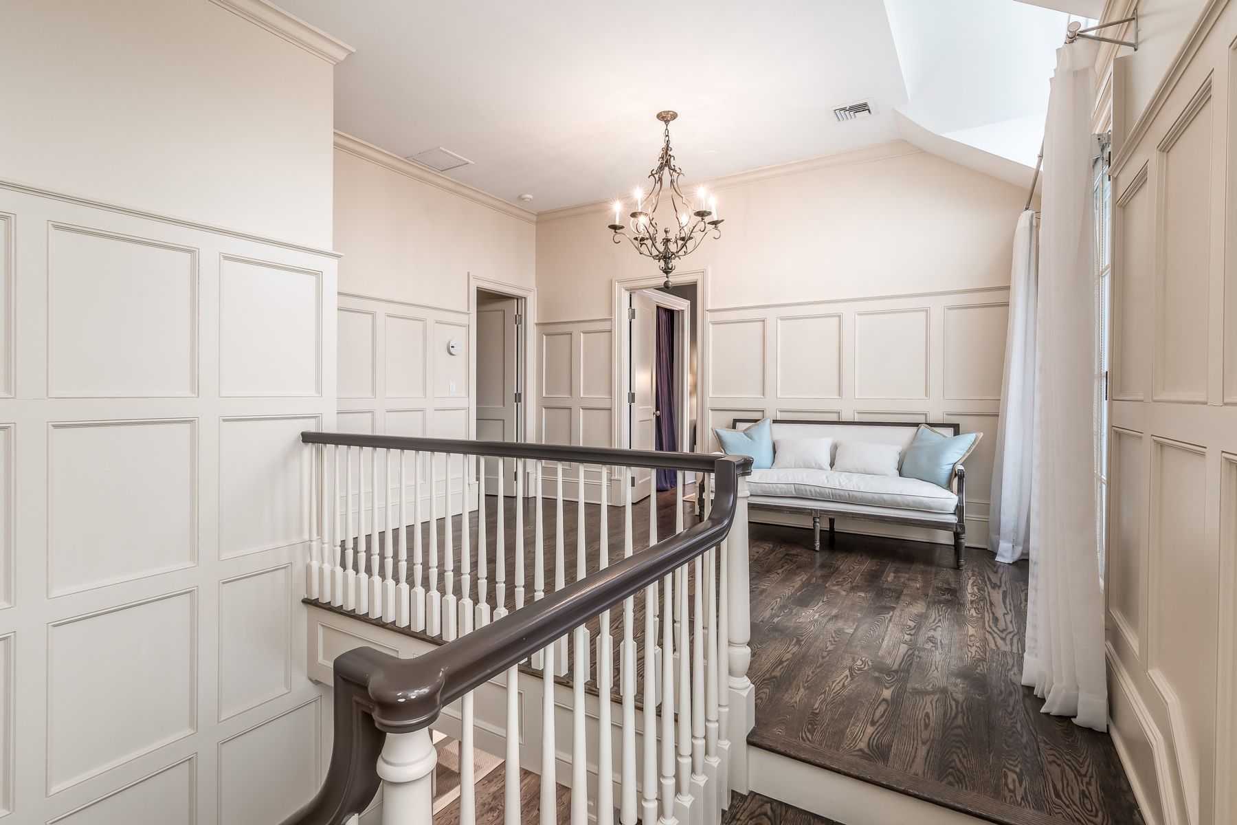 8 Pondview Lane East Hampton, NY 11937 - Photo 16 of 23 a view of a hallway with wooden floor and windows