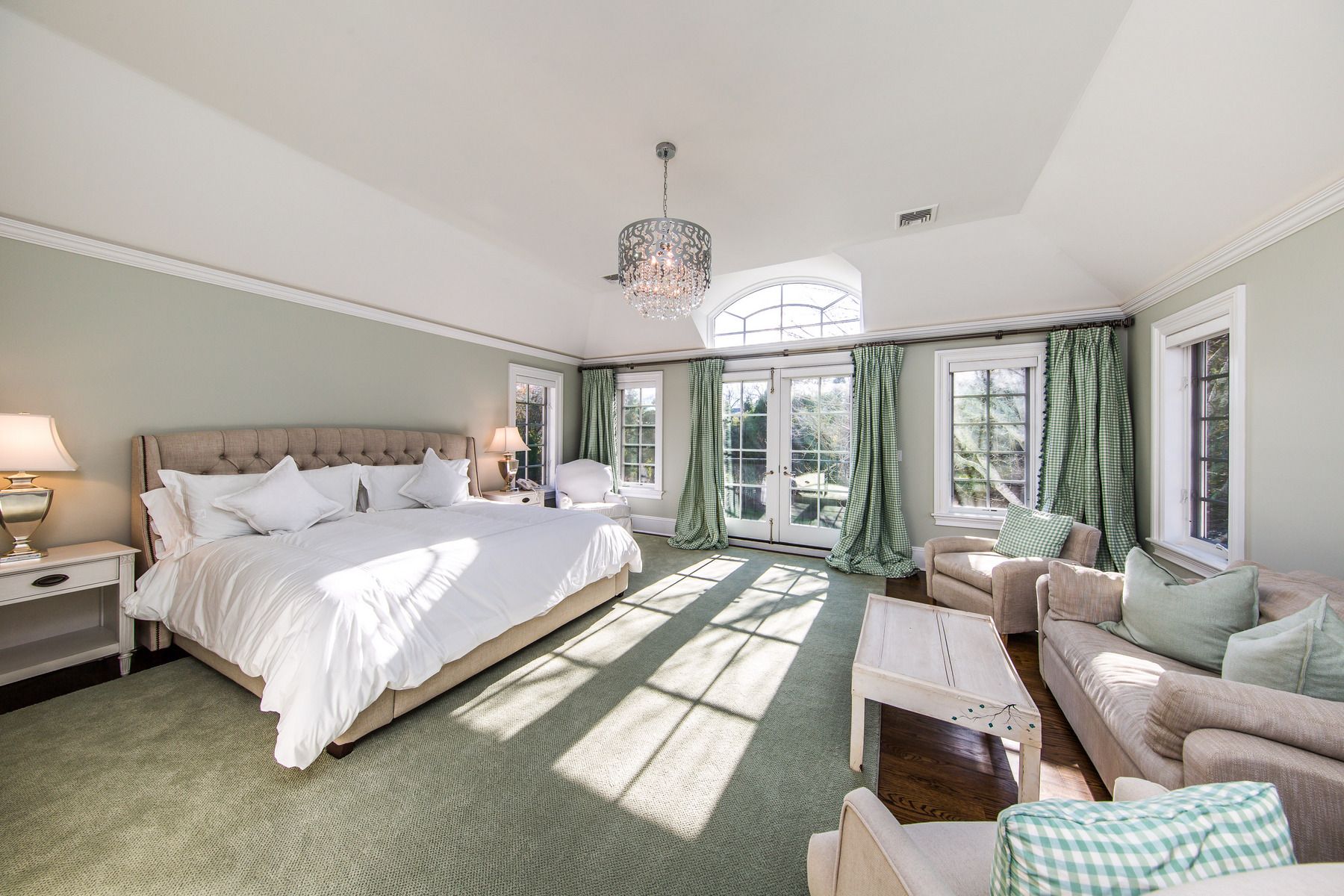 8 Pondview Lane East Hampton, NY 11937 - Photo 17 of 23 a spacious bedroom with a bed and glass windows