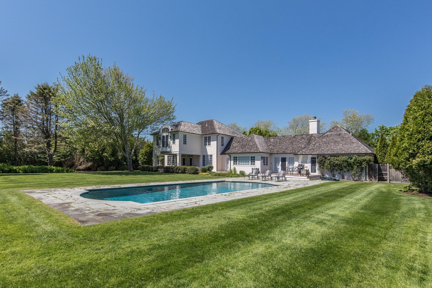 8 Pondview Lane East Hampton, NY 11937 - Photo 2 of 23 a view of a house with a big yard and a large trees with a big yard