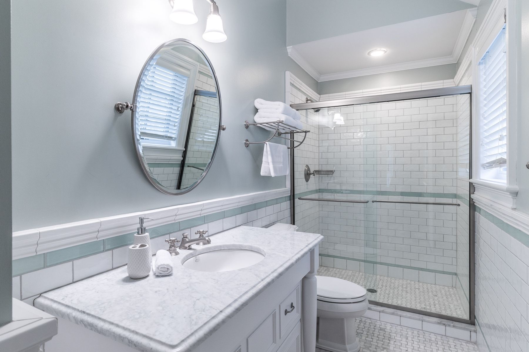 8 Pondview Lane East Hampton, NY 11937 - Photo 21 of 23 a bathroom with a sink a toilet and a mirror