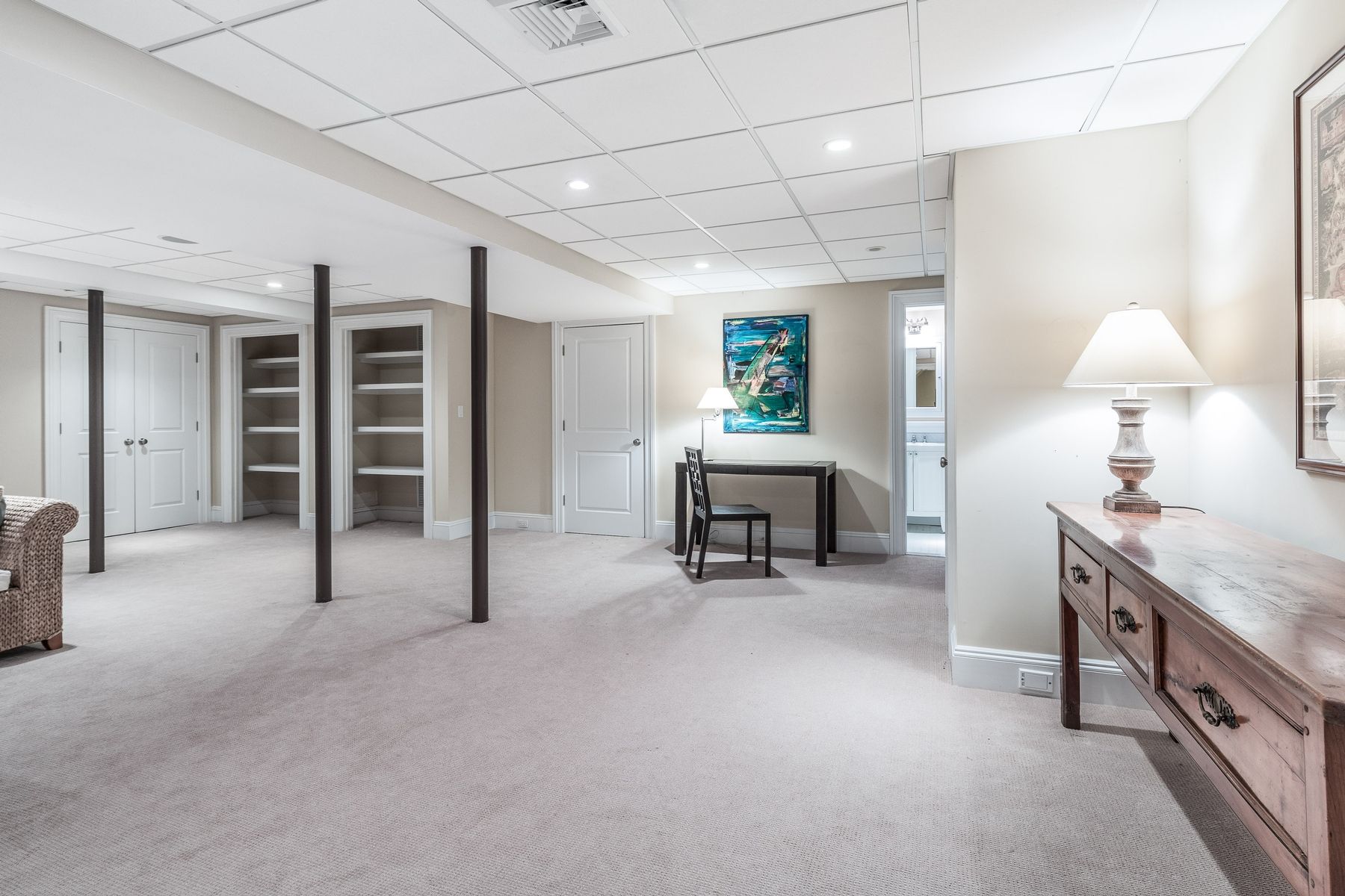 8 Pondview Lane East Hampton, NY 11937 - Photo 22 of 23 a view of a livingroom with furniture and a ceiling fan