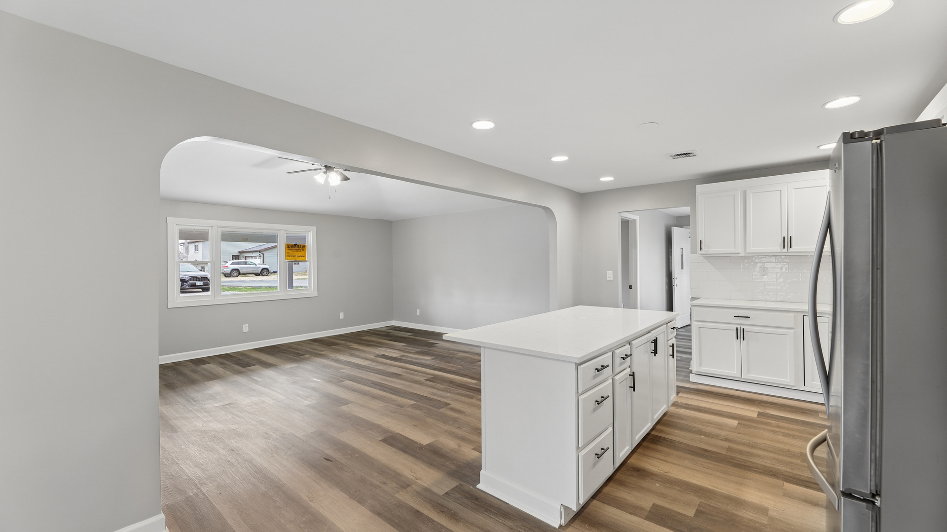 1624 Chicago Street Dixon, IL 61021 - Photo 13 of 29 a kitchen with a white refrigerator freezer a oven and a stove with wooden floor