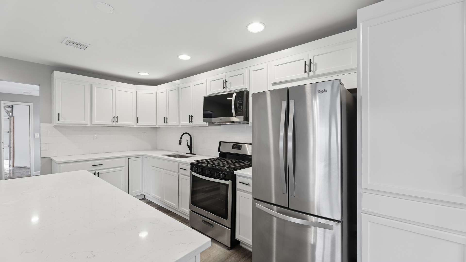 1624 Chicago Street Dixon, IL 61021 - Photo 15 of 29 a kitchen with a refrigerator a stove top oven a sink and cabinets