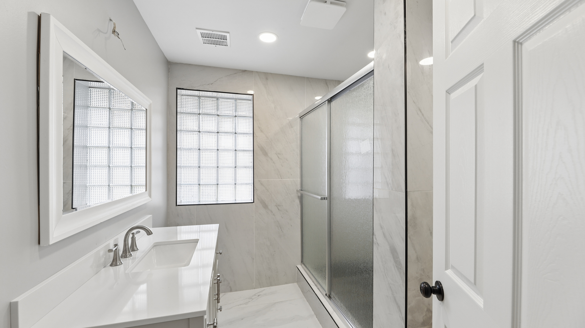 1624 Chicago Street Dixon, IL 61021 - Photo 19 of 29 a bathroom with a shower sink and mirror