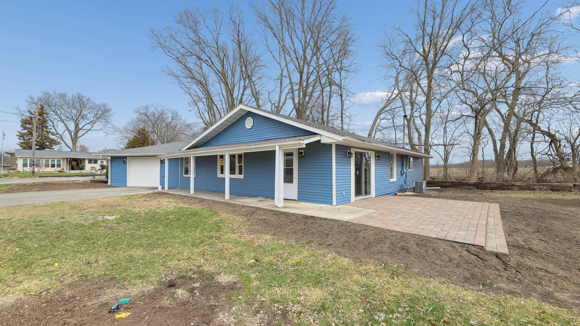 1624 Chicago Street Dixon, IL 61021 - Photo 3 of 29 a front view of a house with a yard and garage