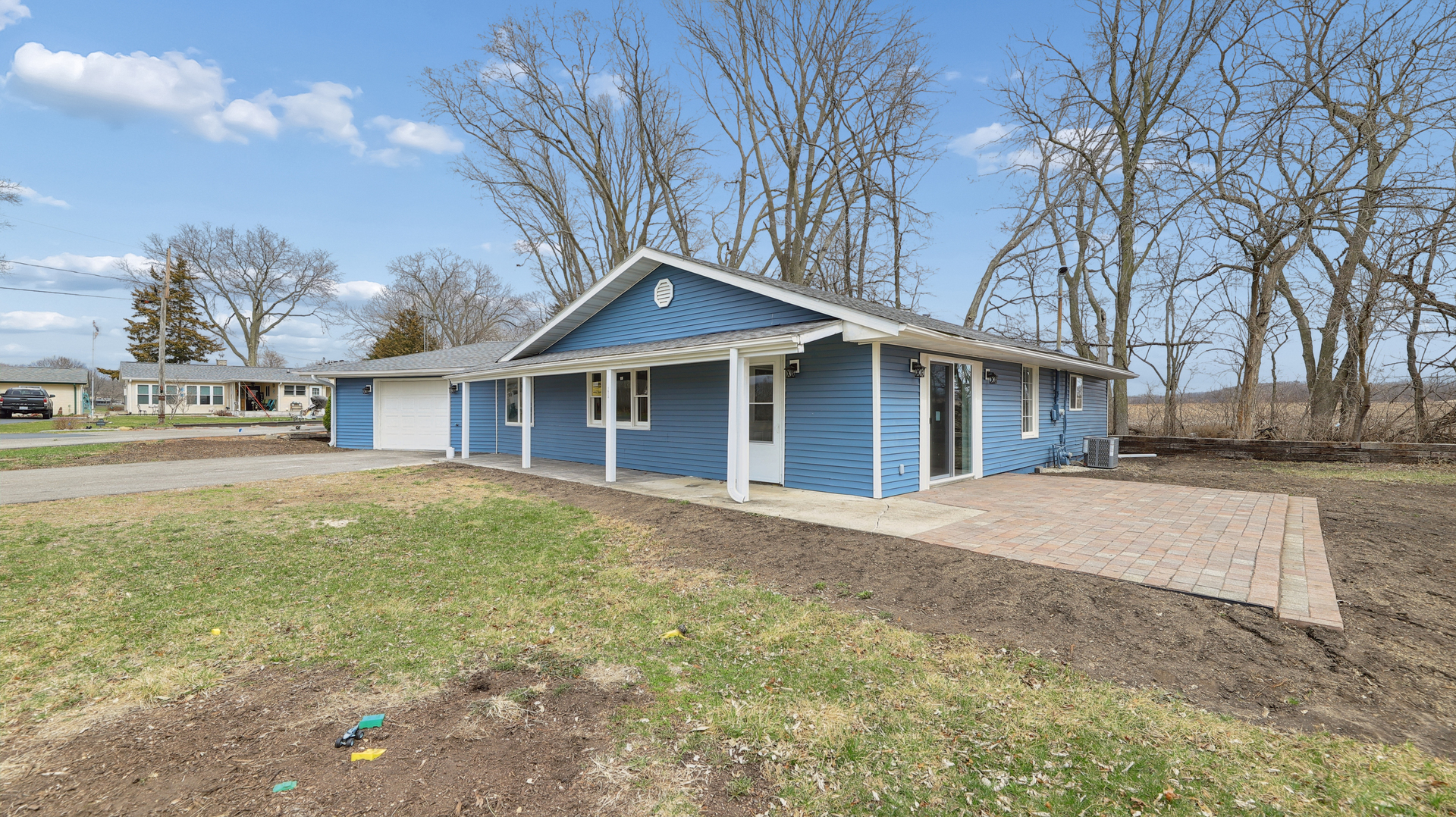 1624 Chicago Street Dixon, IL 61021 - Photo 4 of 29 a view of a house with a yard and garage