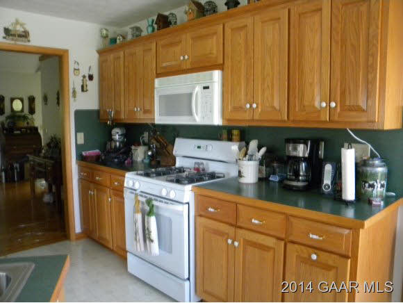 315 Todd Road Mount Sidney, VA 24467 - Photo 4 of 17 a kitchen with stainless steel appliances granite countertop a refrigerator a stove a sink dishwasher and cabinets with wooden floor