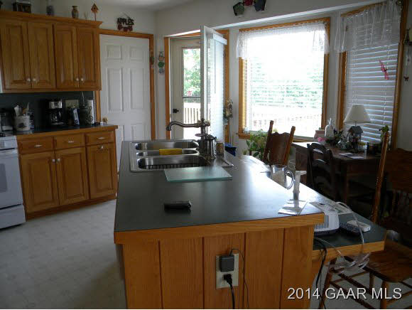 315 Todd Road Mount Sidney, VA 24467 - Photo 6 of 17 a view of kitchen with granite countertop a sink a counter top space and cabinets