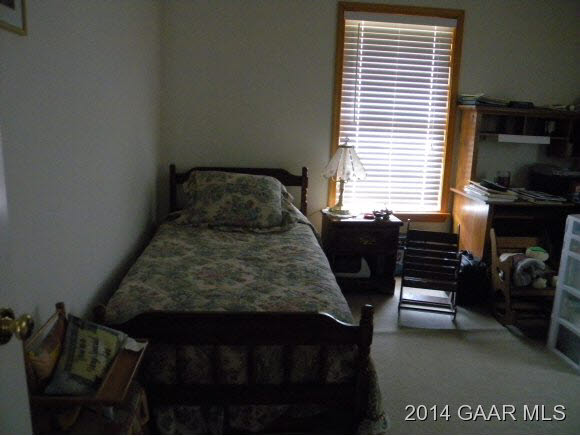 315 Todd Road Mount Sidney, VA 24467 - Photo 7 of 17 a bed sitting in a bedroom next to a window