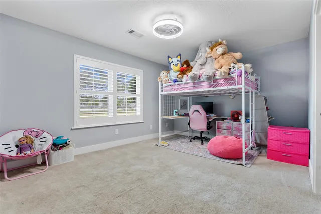 a bed room with a bed and a window