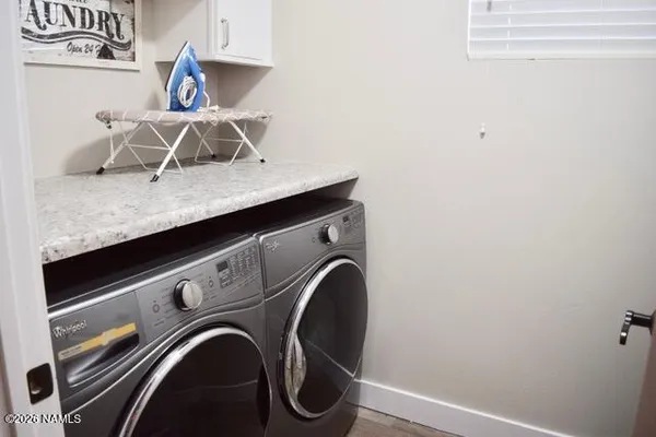 a close view of utility room with washer and dryer