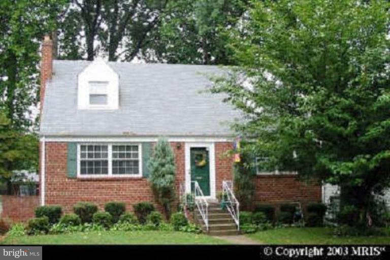 12732 Feldon Street Silver Spring, MD 20906 - Photo 1 of 1 a house that has a tree in front of it