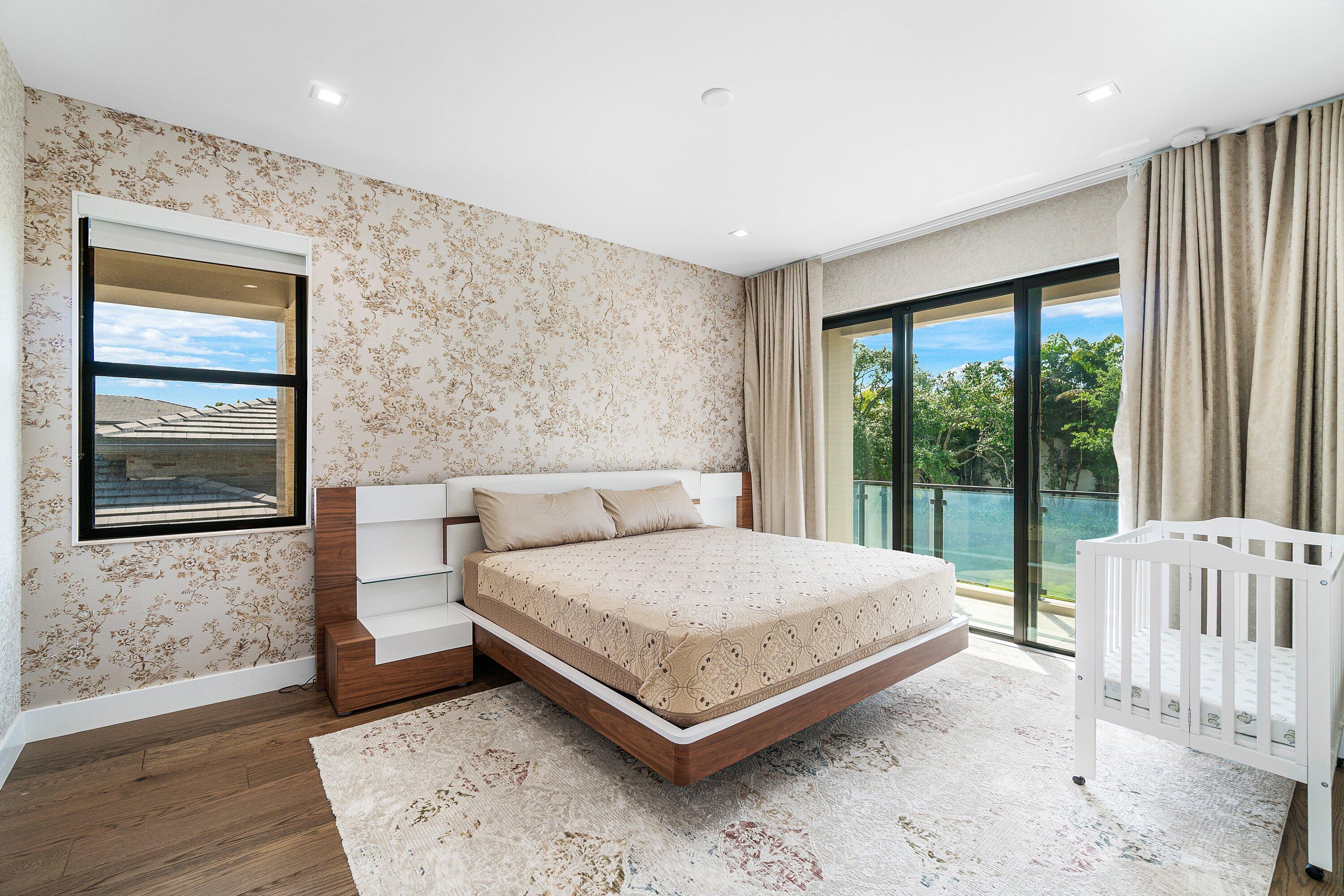 8233 Crystal Downs Avenue Boca Raton, FL 33434 - Photo 41 of 58 a bedroom with a bed and a large window