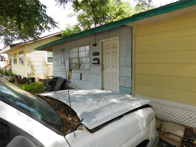 a view of a backyard with sitting area