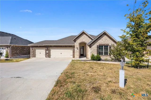 a view of front of house with a street